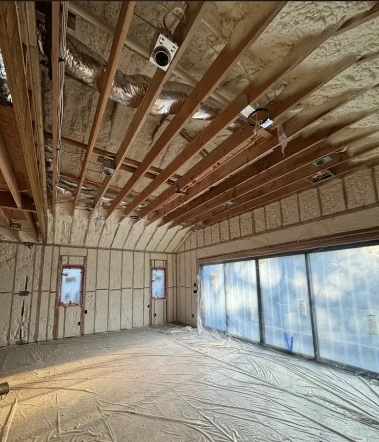 Interior walls and ceiling insulated with spray foam during new construction in Jersey Village
